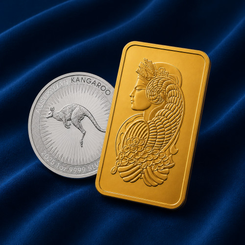 A gold bar and a silver Australian Kangaroo coin on navy velvet