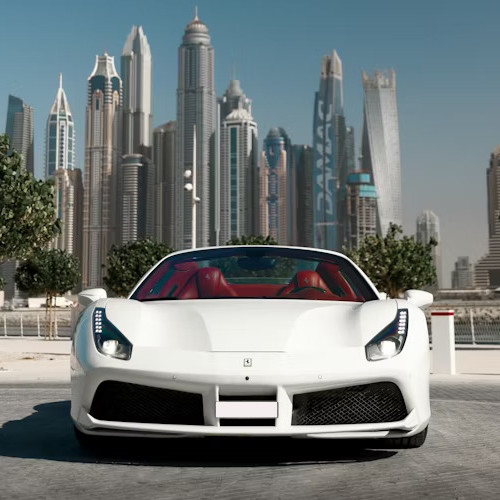 A white Ferrari convertible in front of the Dubai Marina towers