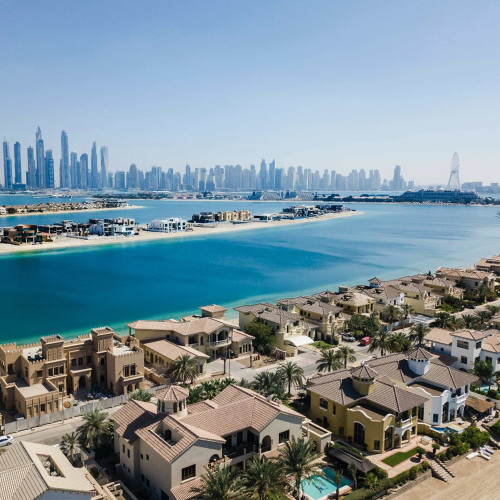 Villas on the Palm Jumeirah with the Dubai Marina skyline behind
